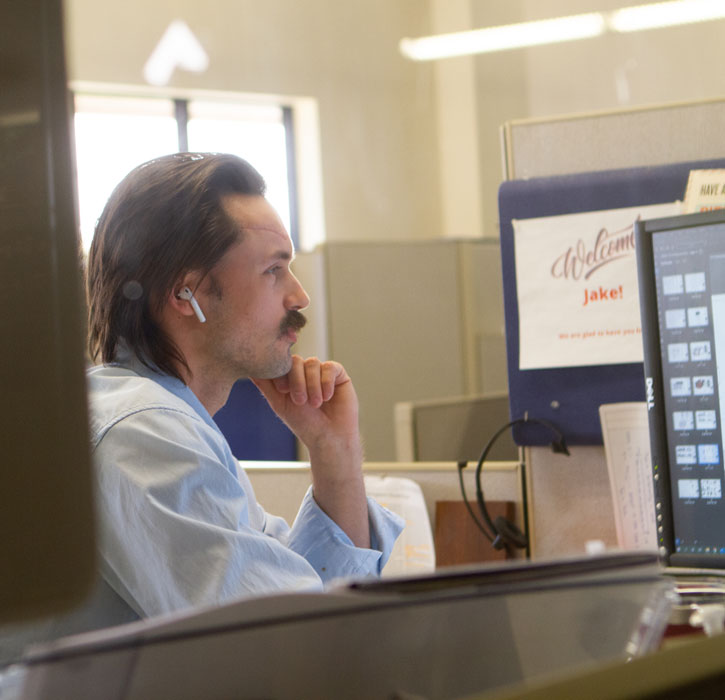 Staff Engineer Jake McConnell working at a computer