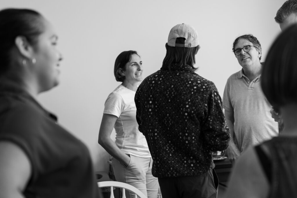 Group of engineers socializing and smiling black and white