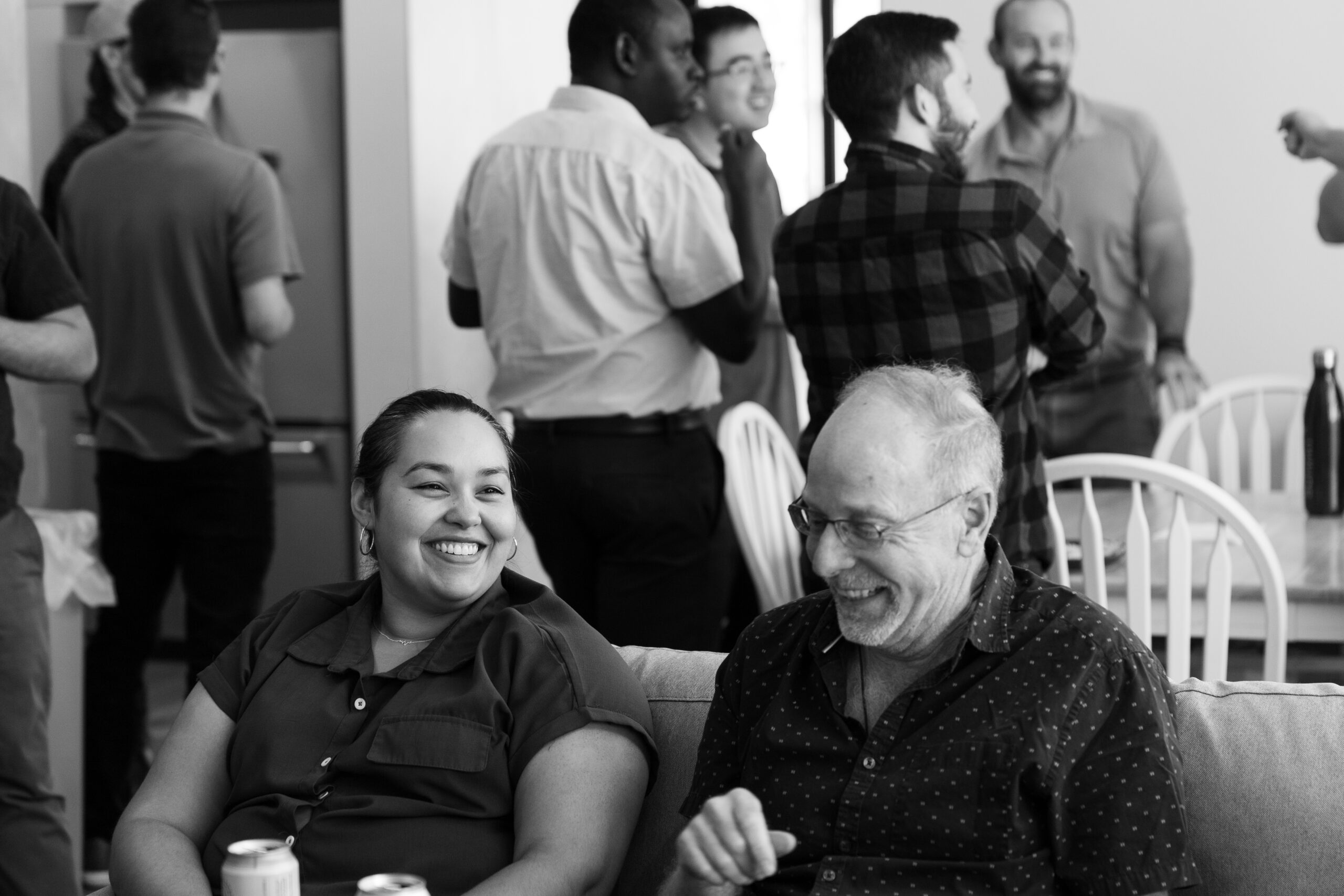 Engineers laughing on a couch