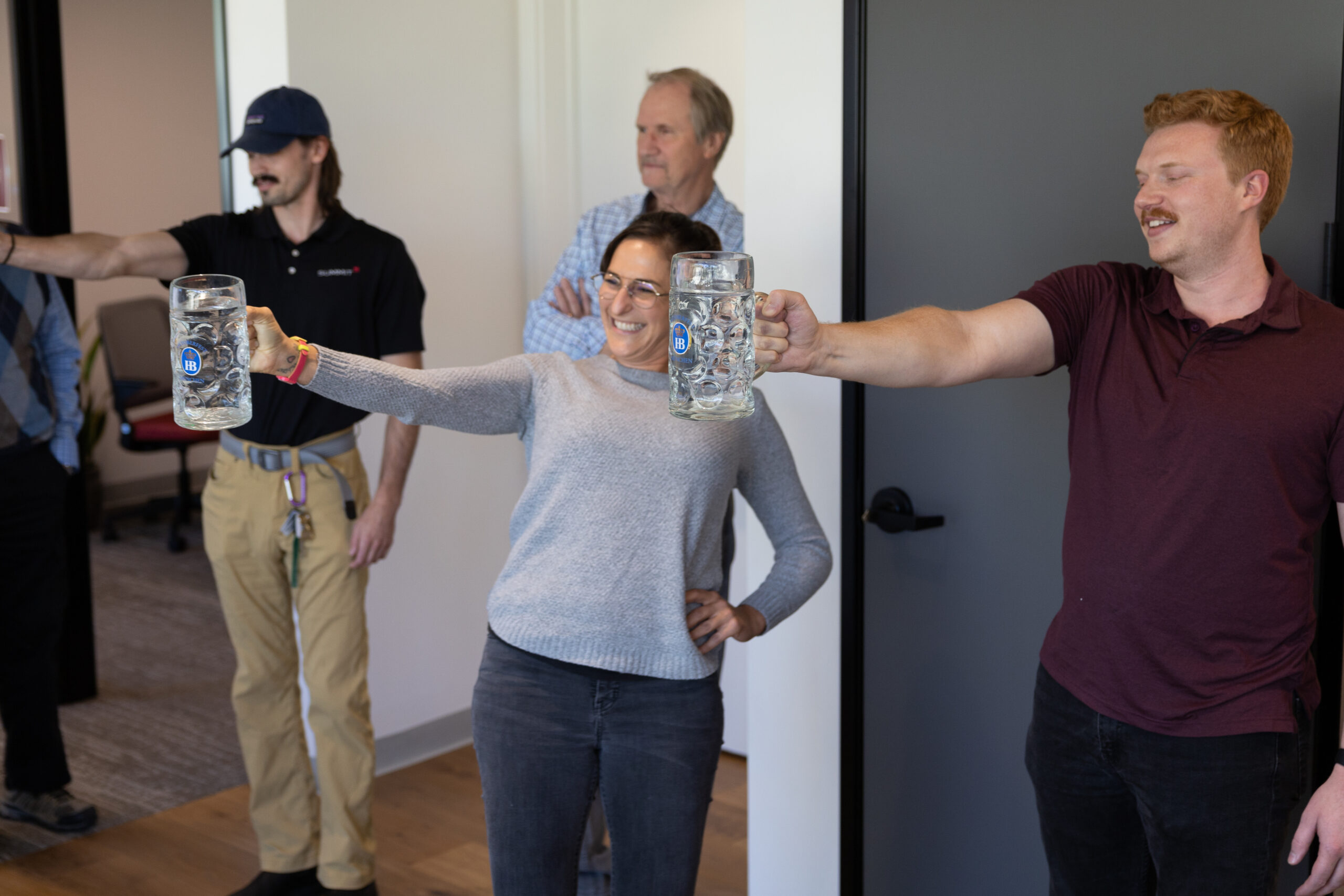 Engineers holding beer steins