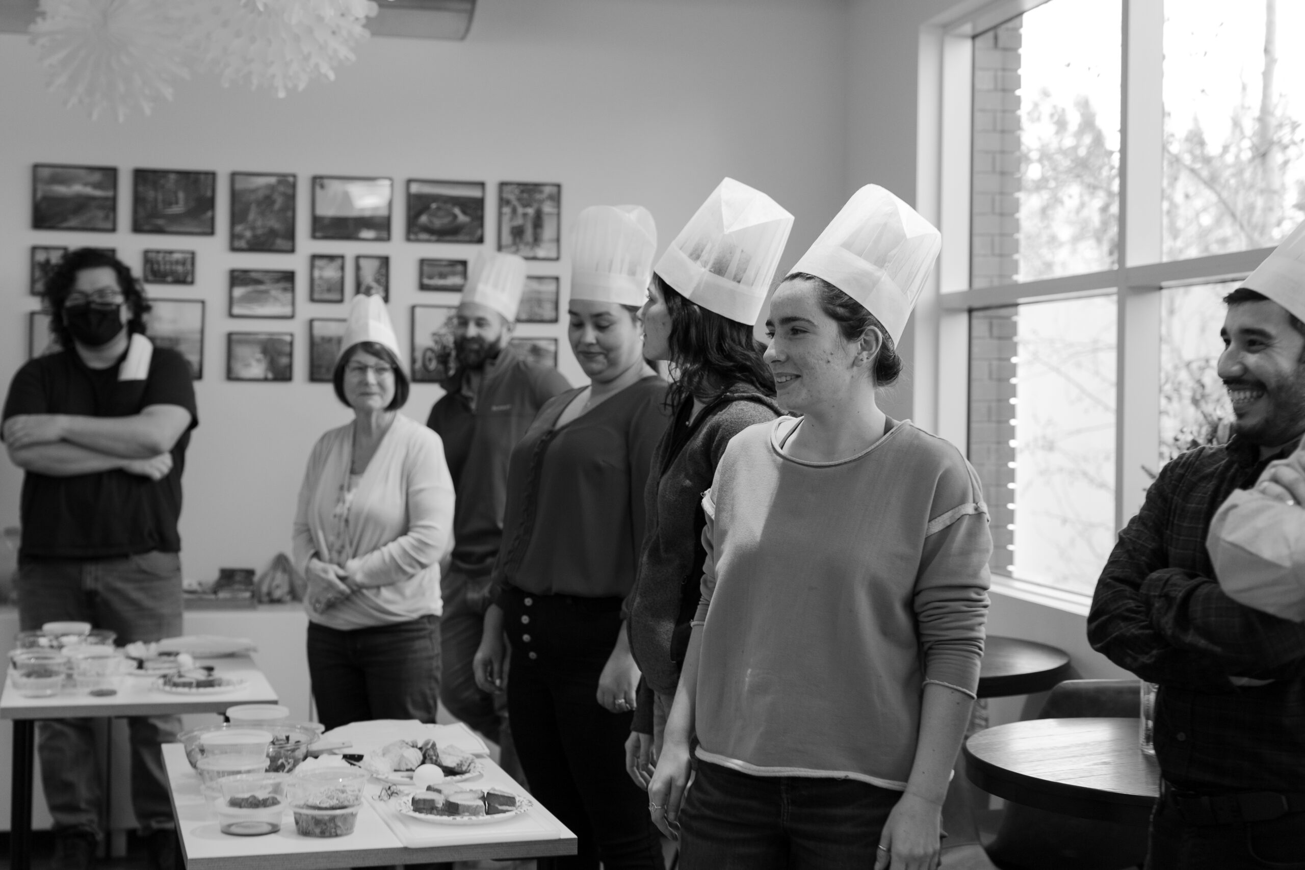 Black and white image of engineers in chef hats