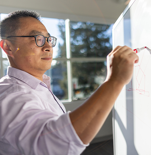 Man drawing on a whiteboard